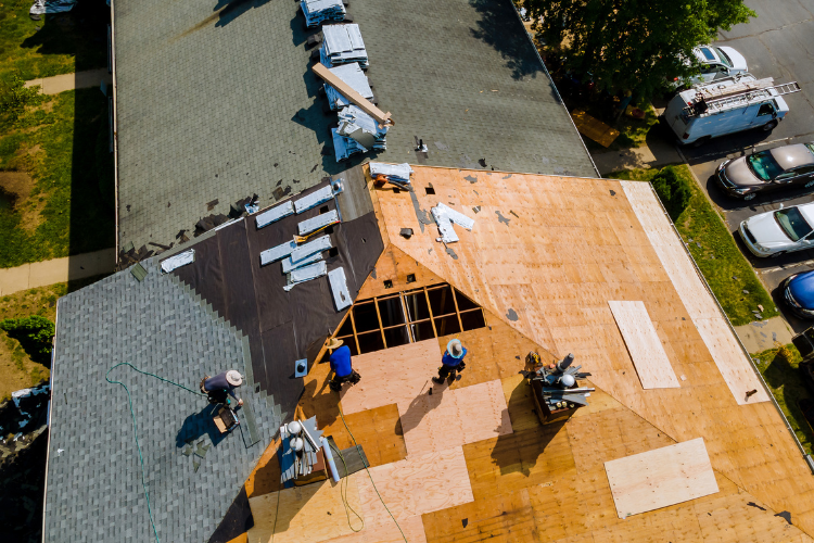 Thomas Roofing team repairing a roof in Towson